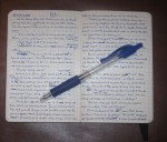 A Moleskine notebook and Pilot G-2 .05 mm blue pen