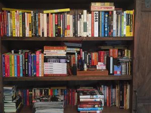 My bookshelf at home. I've whittled my books down to favorite authors and books by friends.